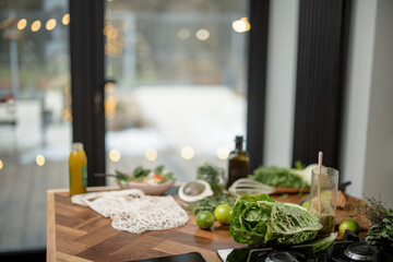 Cooking healthy food with vegetables and greens on the table. Healthy and wellness concept. High quality photo