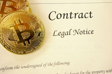 Gold bitcoin cyptocurrency and a legal contract