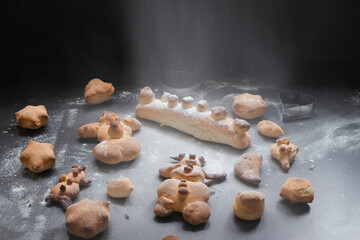 Kids activity with bread dough, baked snowman and other figures 