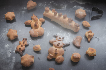 Kids activity with bread dough, baked snowman and other figures 