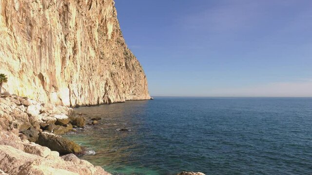 Sea cliffs of headland and wide blue sea, calpe, spain
