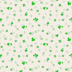 Seamless pattern with clover leaves.Magical plant. Background for St. Patrick's Day. Green endless backdrop with trefoils and quatrefoils. Shamrock. Irish story.