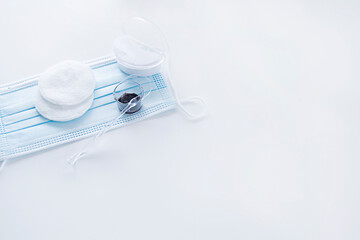 Means for coloring and correcting eyebrows on a blue medical mask. copy space