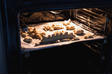Kids activity with bread dough at home, getting it ready to bake