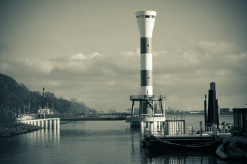 New lighthouse on the banks of the Elbe in Hamburg in winter black and white