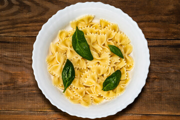 Plate with noodles on a wooden table
