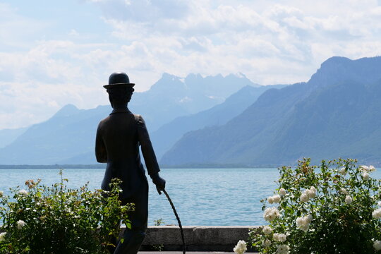 statue of charlie chaplin in vevey, switzerland facing lake geneva