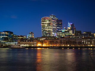 Naklejka premium River Thames, and City of London skyline at night London, UK