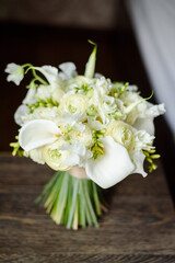 bouquet of white flowers on wooden background