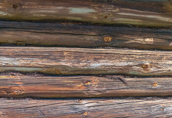 Old log wall of a wooden village house