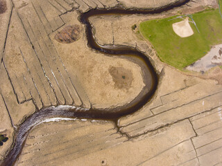 Essex historic town center on Main Street and Essex River swamp aerial view in spring in Cape Ann, Massachusetts MA, USA. 
