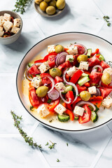 Greek salad with feta cheese, tomatoes, red pepper, olives, cucumber