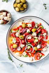 Greek salad with feta cheese, tomatoes, red pepper, olives, cucumber