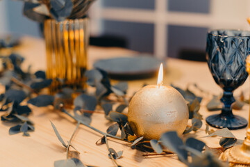 Table setting in blue and gold colors.