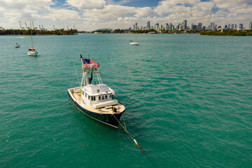 Trolling boat anchored in the bay Miami aerial photo