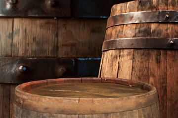 Fototapeta premium background of barrel and worn old table of wood