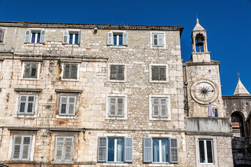 Fototapeta na wymiar Historic building and clock tower in the historic center of Split, Croatia