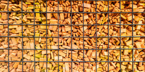 Orange brick wall decoration in steel grill