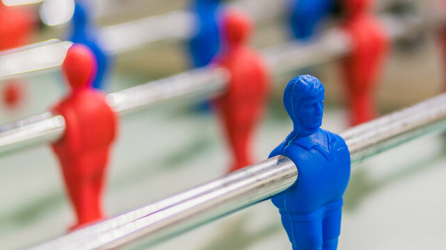 Red And Blue Table Football Player On Steel Rod Isolated, GREEN BACKGROUND