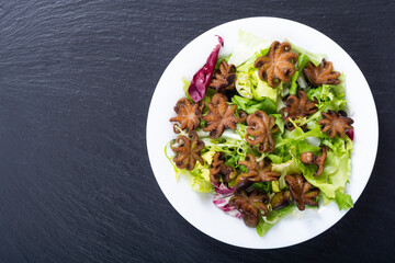 Salad with Baby octopus fried