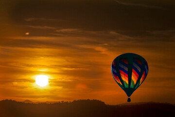 Sunset with hot air balloon in sky