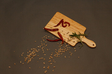 Wood Board With red chili pepper with rosemary Ideas