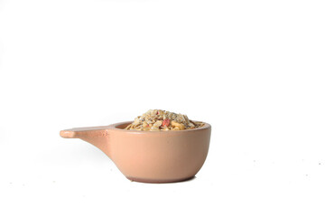 yellow bowl of granola isolated against white background. Healthy eting concept