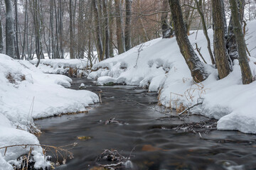 Olsovy creek near Petrovice village in Krusne mountains in winter cold morning