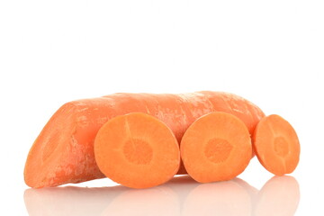 One fresh organic, unpeeled carrot cut into slices, close-up, isolated on white.