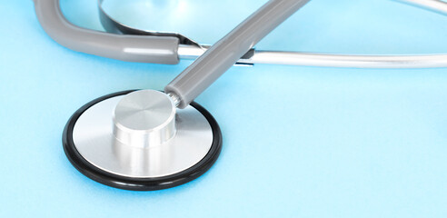 Healthcare insurance background concept.space for design. Stethoscope on blue paper.