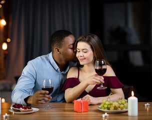 Dinner For Two. Loving Interracial Couple Dining At Home In Romantic Atmosphere