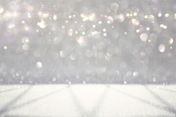 glitter vintage lights background. silver, gold and white. de-focused