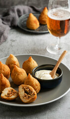 coxinha - popular food in Brazil consisting of chopped or shredded chicken meat covered in dough