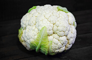 Healthy and fresh cauliflower on wooden background