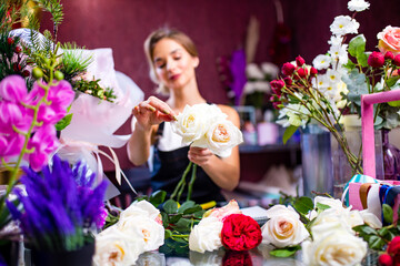 Cropped view of florist making flower bouquet close up