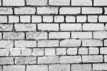 Texture of a brick wall with cracks and scratches which can be used as a background