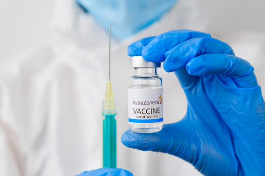 AstraZeneca vaccine and disposable syringe for injection in doctors hands. Prevention of coronavirus, Sars-cov-2, Covid-19, January 2021, San Francisco, USA.