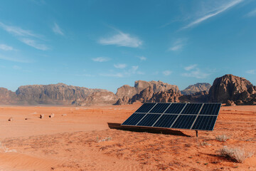 Panel of modern solar battery installed on dry ground in Wadi Rum valley on sunny day