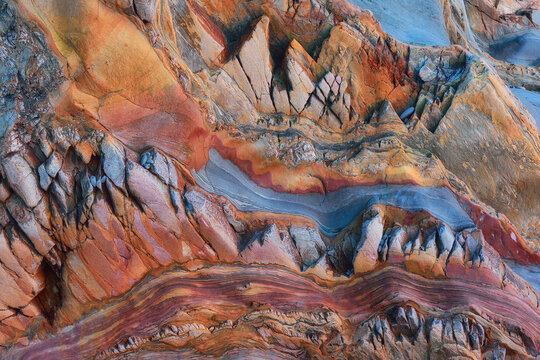 Texture patterns and colors on a cliff of a beach in Asturias