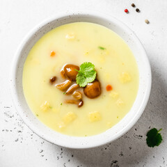 Vegetarian mushroom soup in a bowl. Space for text, top view.