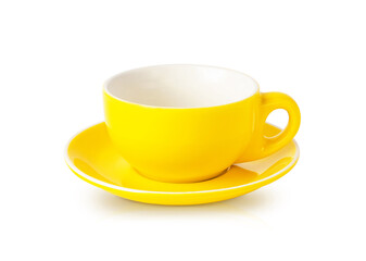 Empty yellow teacup with saucer isolated on white