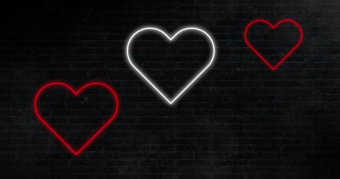 Animation of red and white neon hearts flashing on black background