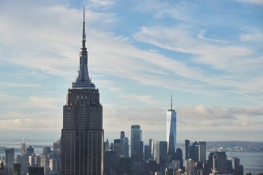 Magnificent view of Manhattan with tall glass skyscrapers on background of blue cloudy sky in New York