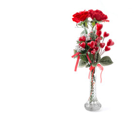 Artificial Valentine Roses and hearts on white with copy space