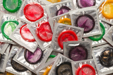 Colorful condoms background.