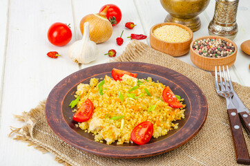 Healthy food. Couscous with chicken and vegetables. Studio Photo