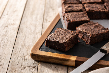 Homemade pieces of brownies on wooden table