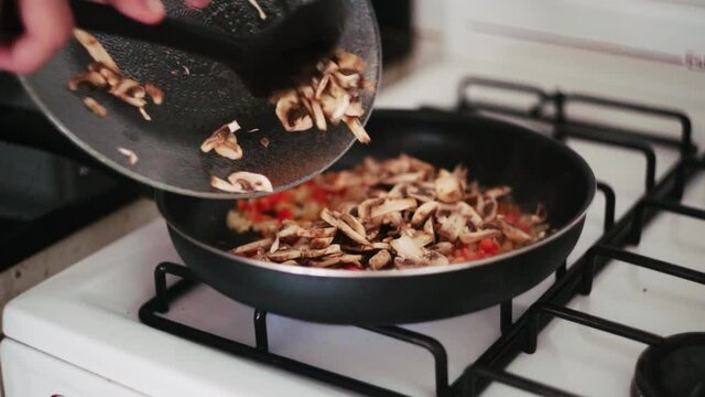 cooking mushrooms at the kitchen