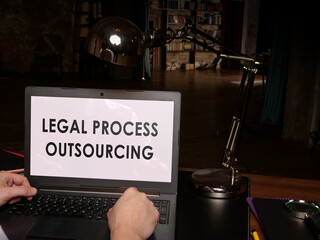 Legal process outsourcing data and rules on the laptop.