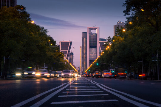 Magnificent view of asphalt road with traffic cars at dusk in Madrid